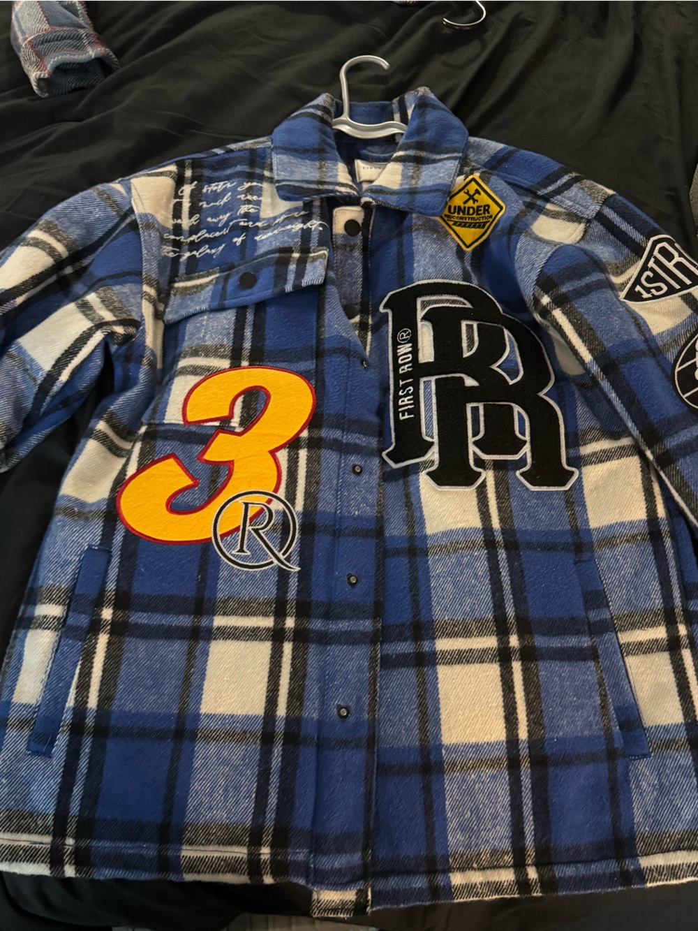 First Row Blue Plaid Patchwork Shacket with Graphic Patches
